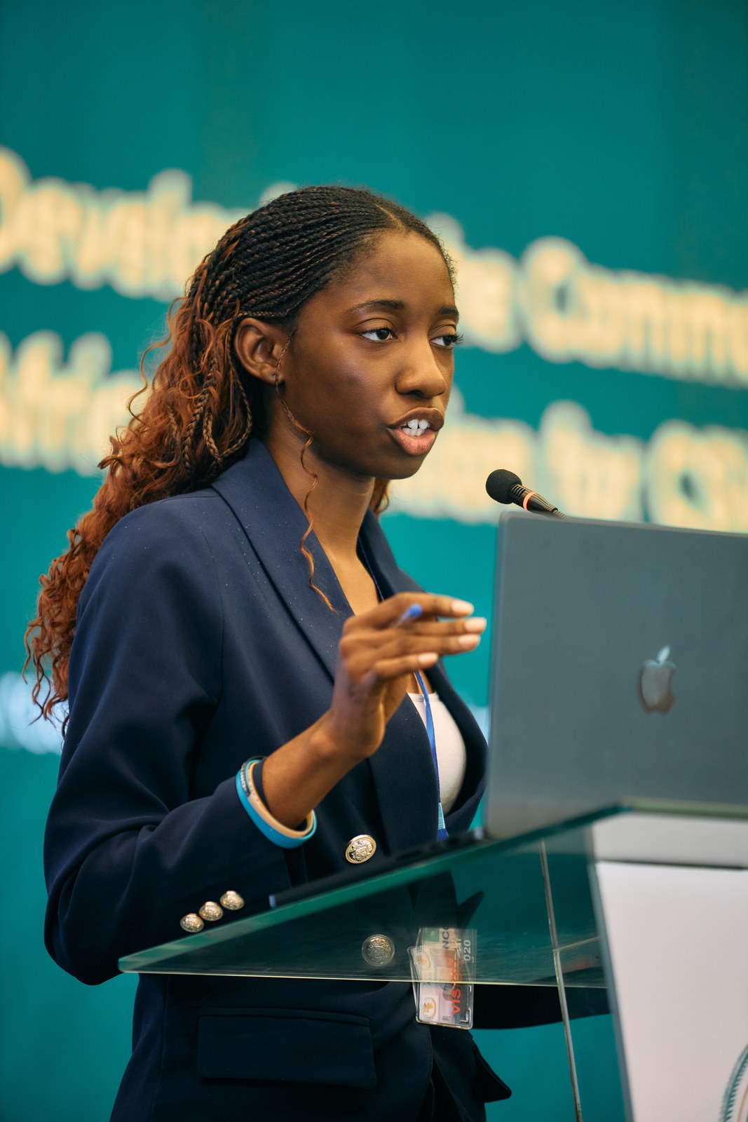 Speaker presenting work on the Common African Position during the Africa Care Forum
