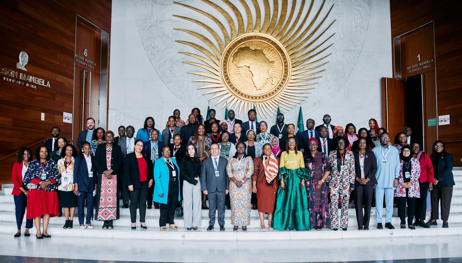 Official group photograph of Africa Care Forum participants beneath the African Union emblem in Addis Ababa