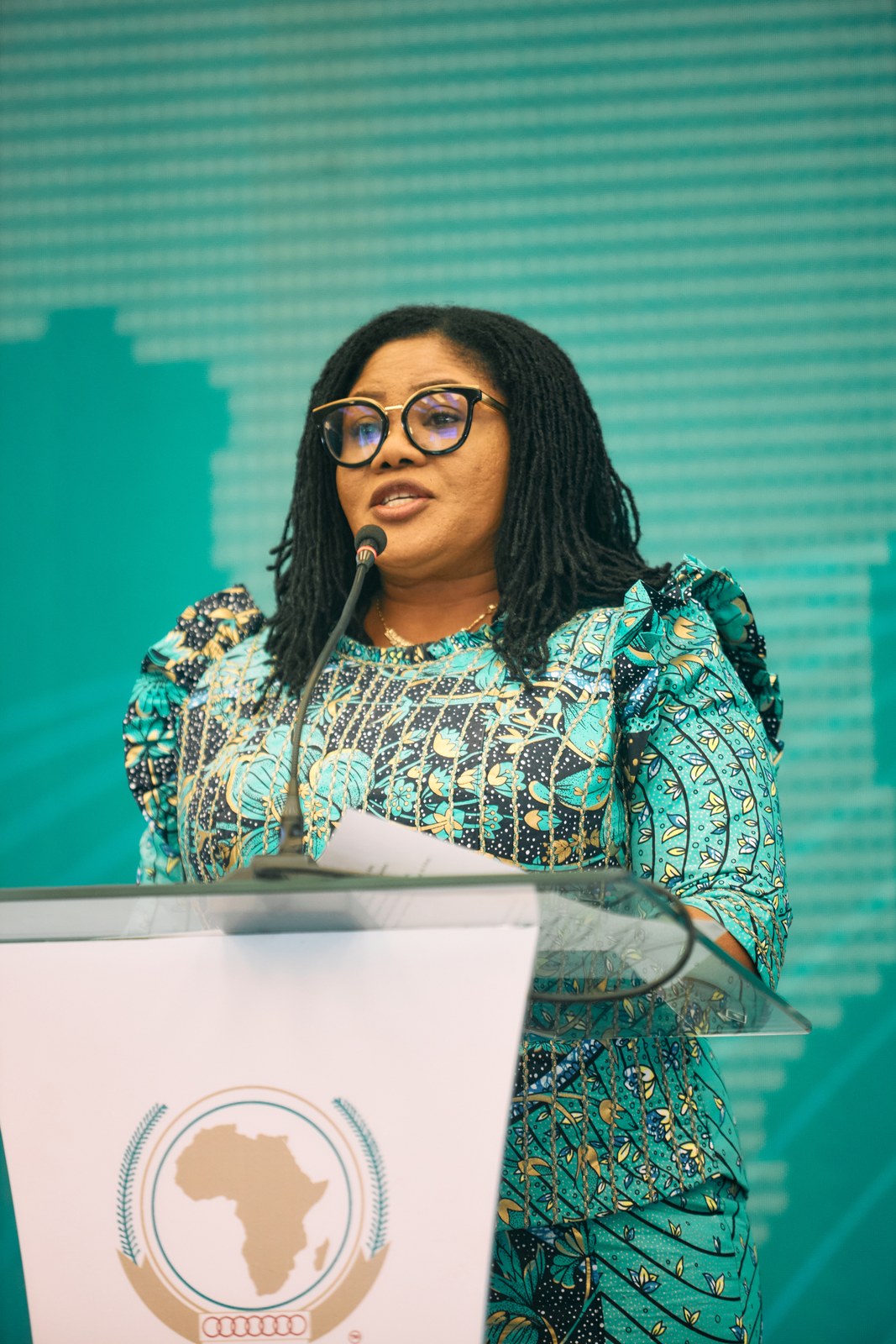 Speaker addressing delegates from the podium at the inaugural Africa Care Forum
