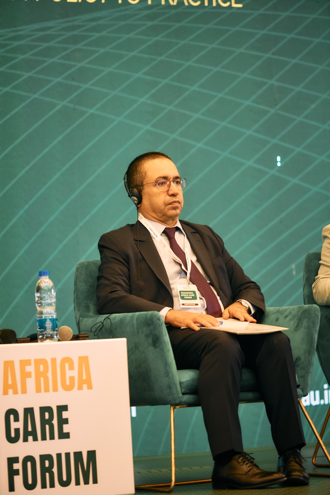 Panellist listening during the Policy and Investment Plenary at the Africa Care Forum